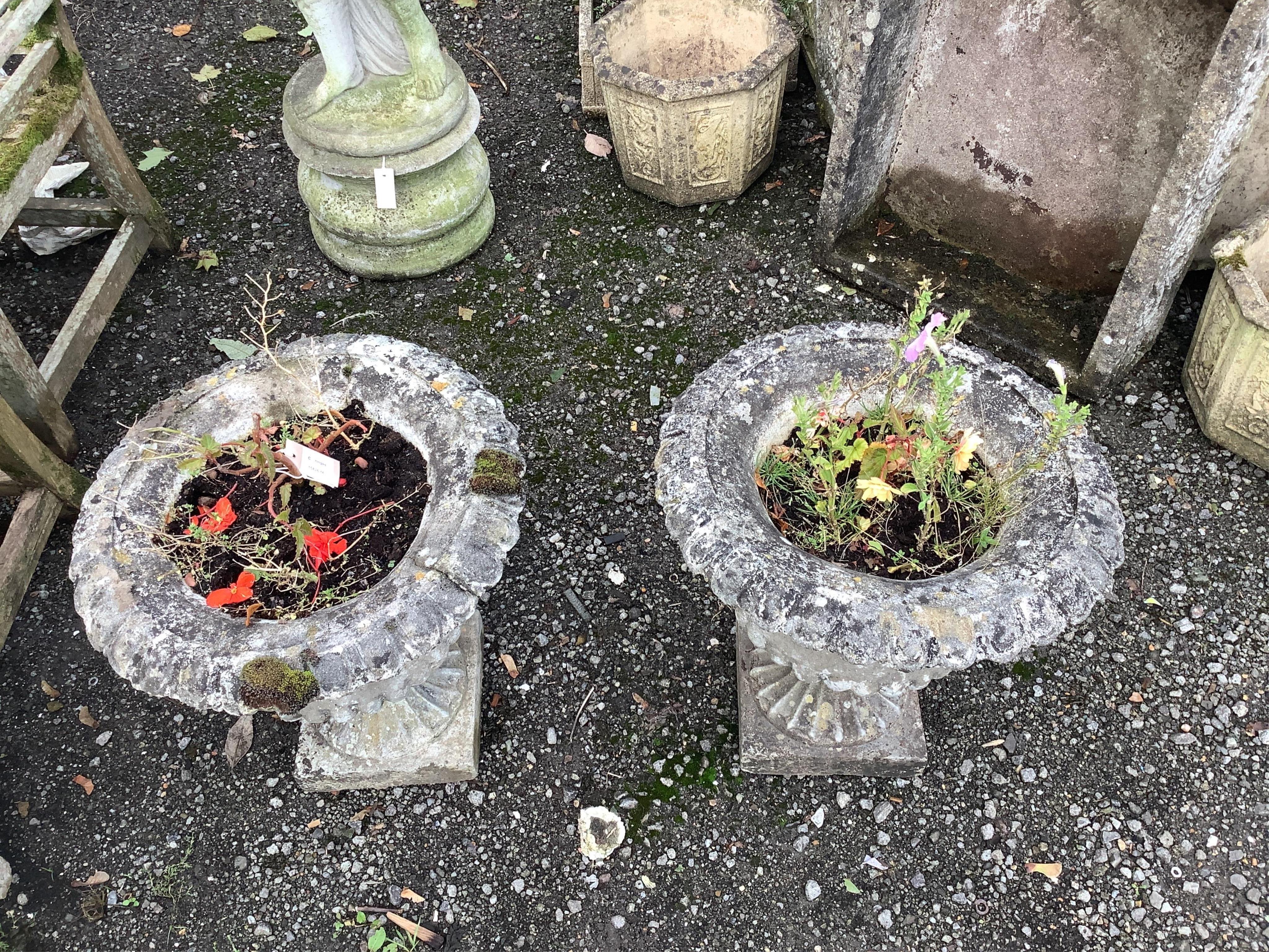 A pair of circular reconstituted stone campana garden urns, diameter 51cm, height 54cm. Condition - fair